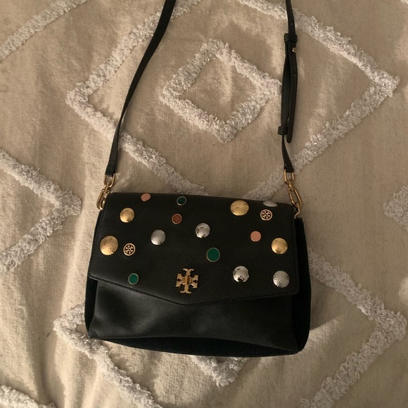 Tory Burch—100% leather. This bag has lots of room, three pockets. - Picture 4 of 10